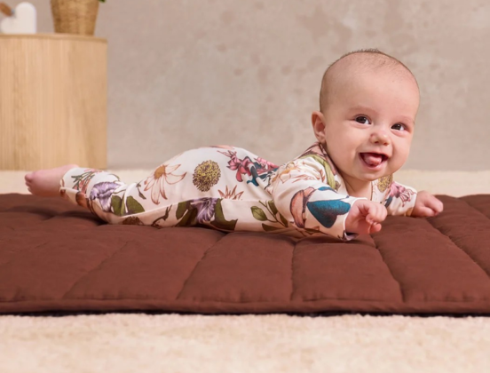 When Do Babies Roll Over? Signs & Safer Sleep Tips