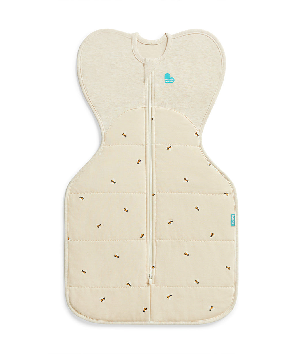 Beige baby sleeping bag with subtle pattern on a white background