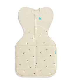 Beige baby sleeping bag with subtle pattern on a white background